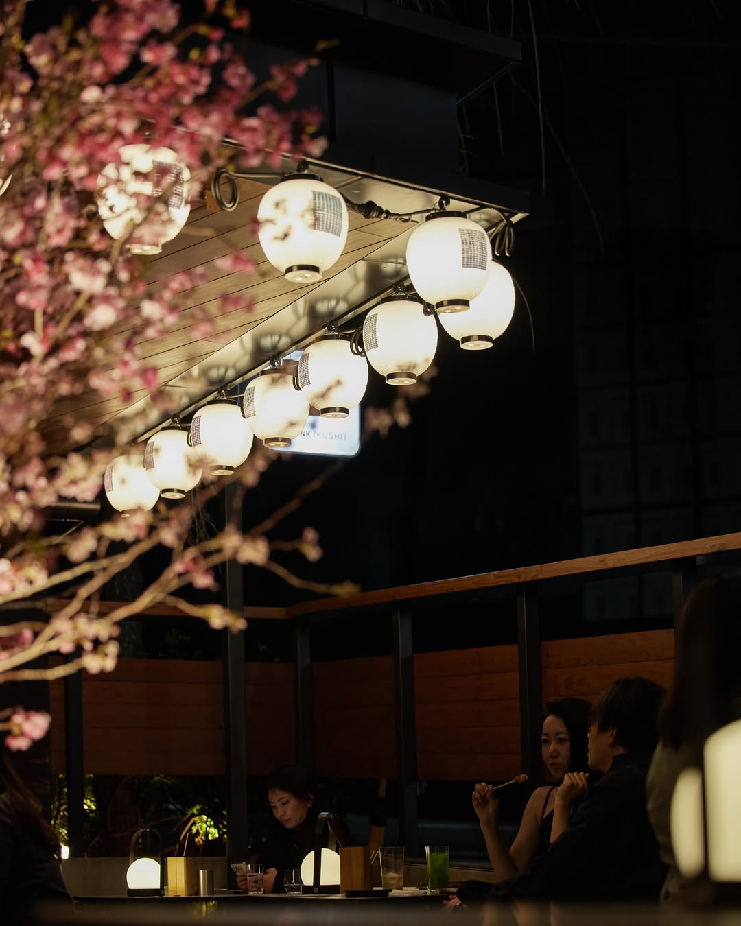 Japanese lanterns and cherry blossoms at dining venue